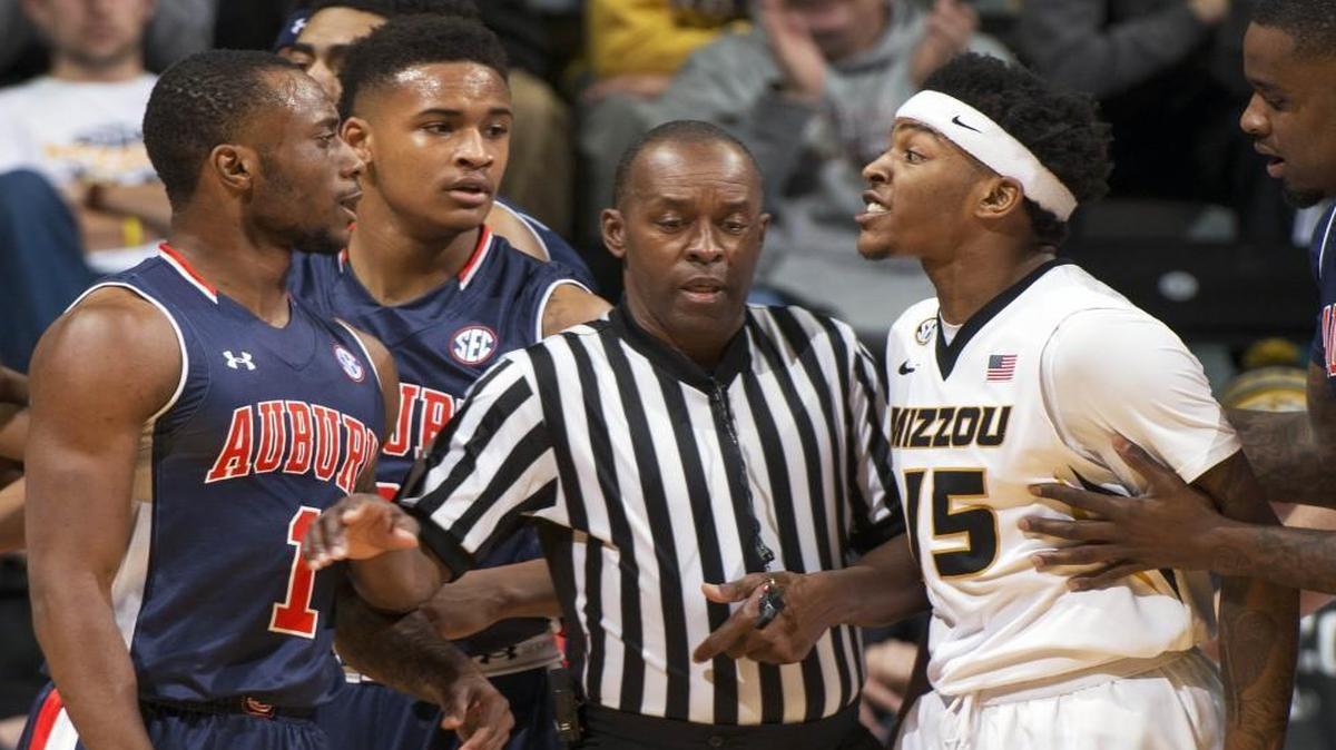 Missouri’s Wes Clark (right) was held back as he argued with Auburn’s Kareem Canty after an altercation that left both players with technical fouls in the first half Saturday night at Mizzou Arena in Columbia.