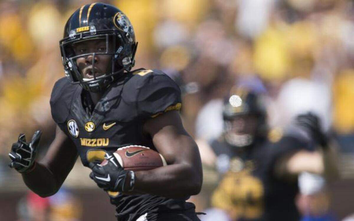 
Missouri Tigers wide receiver Darius White (8) looks over his shoulder as he heads into the end zone to score in the first quarter during the University of Missouri and South Dakota State University football game at Faurot Field on Saturday, August 30, 2014, in Columbia, Missouri.
