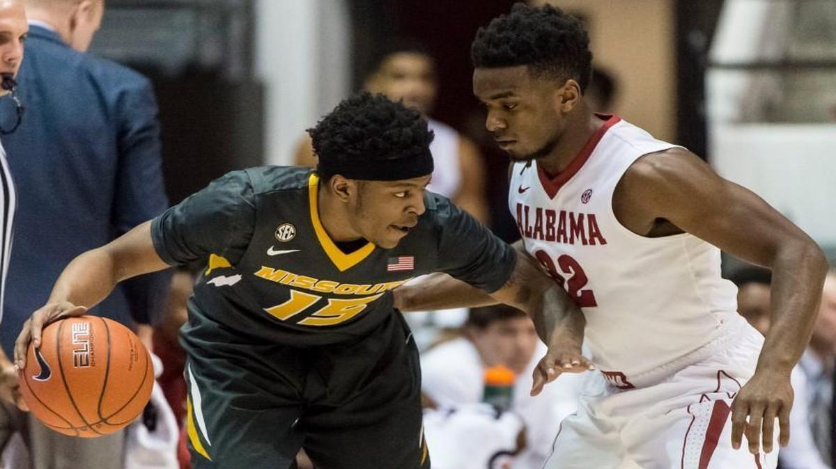 Missouri guard Wes Clark (15) worked against Alabama guard Retin Obasohan (32) as the Tigers and Crimson Tide played Saturday in Tuscaloosa, Ala.