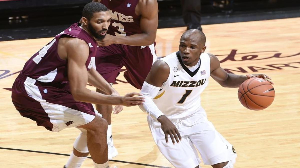 Missouri's Terrence Phillips (right) dribbles around Maryland-Eastern Shore's Derrico Peck (left) and Mark Blackmon during Sunday’s NCAA college basketball game at Mizzou Arena. Missouri won the game 73-55.
