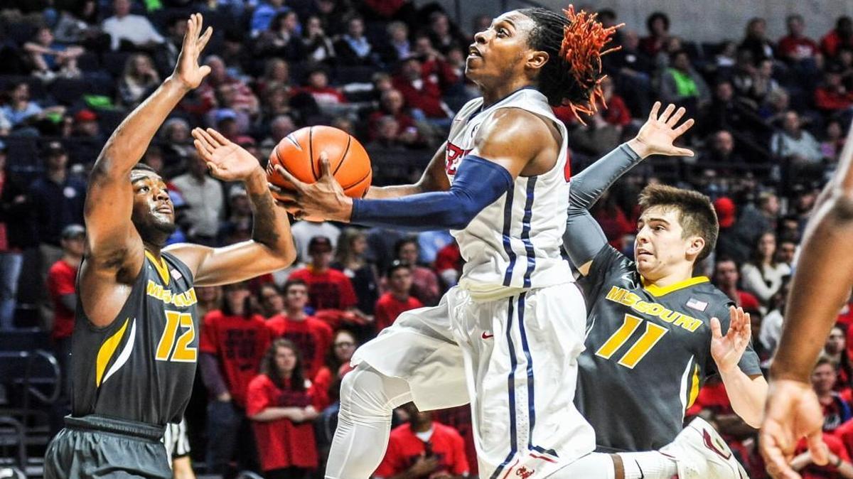 Mississippi guard Stefan Moody (center) drove to the basket defended by Missouri guards Namon Wright (left) and Jimmy Barton as the Rebels and Tigers played Tuesday night in Oxford, Miss. Moody finished the game with 27 points, eight rebounds and eight assists as the Rebels won 85-76.