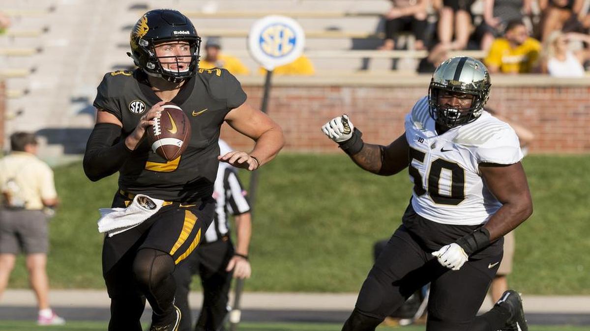 Missouri quarterback Drew Lock is forced out of the pocket by Purdue’s Keiwan Jones during the third quarter of the Boilermakers’ 35-3 win Saturday.