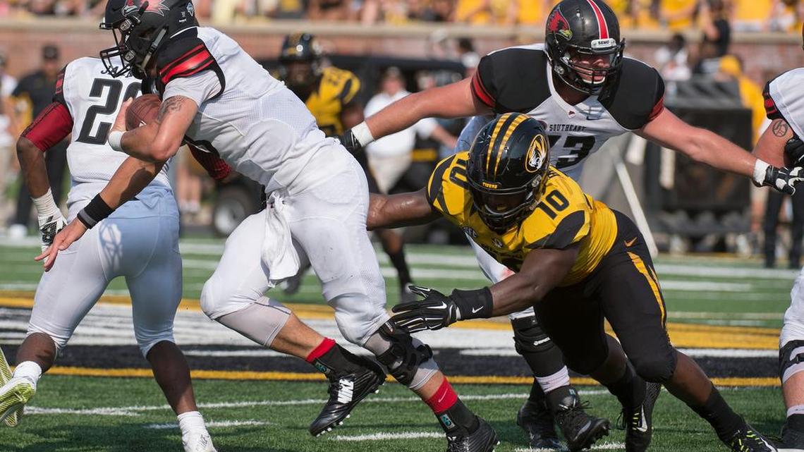 
Missouri linebacker Kentrell Brothers (right) grabbed Southeast Missouri State quarterback Tay Bender for one of his 16 tackles Saturday in the Tigers’ 34-3 victory.
