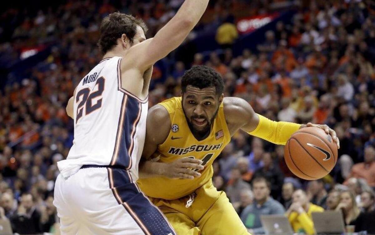 Missouri’s Kevin Puryear (right) had 17 points and nine rebounds in a 75-66 loss to Illinois on Dec. 21.