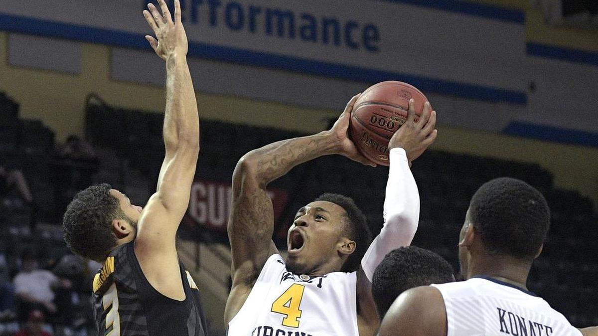 Missouri guard Kassius Robertson (left) said he and the Tigers’ experienced players needed to prepare their younger players better for a crunch-time situation against West Virginia.