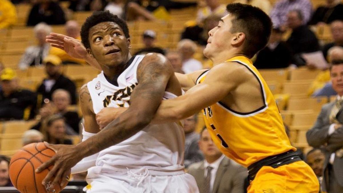 Missouri's Wes Clark (left) looks to shoot past Missouri Western's Wes Mitter during Friday’s college basketball exhibition game in Columbia.