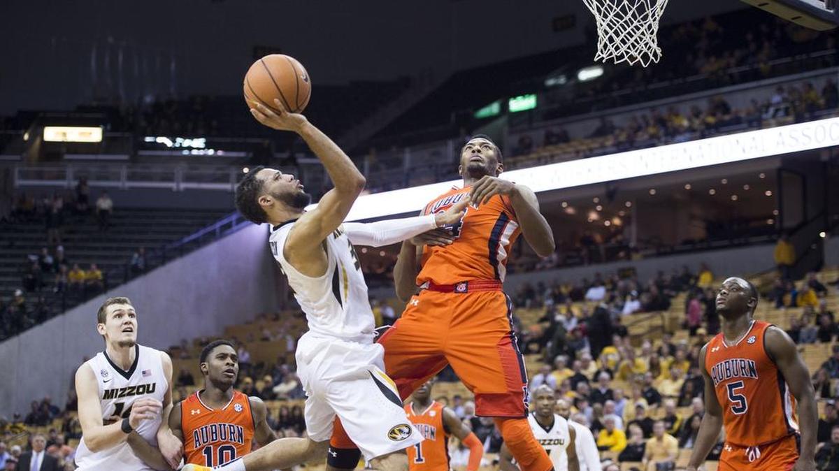 Missouri Tigers guard Kassius Robertson (3) created some space between himself and Auburn Tigers forward Anfernee McLemore (24) in the second half of Mizzou’s 91-73 loss on Wednesday in Columbia.