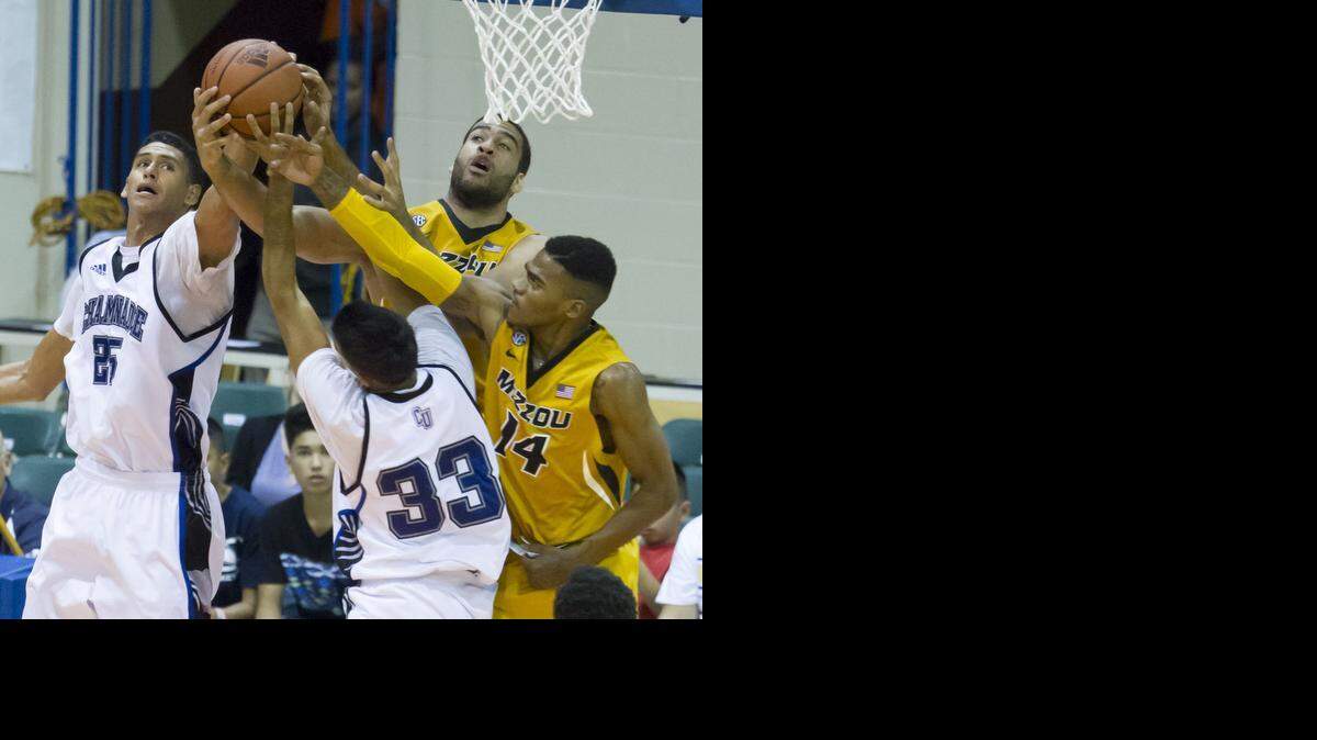 Chaminade forward Frankie Eteuati, left, and guard Kiran Shastri (33) battle Missouri forward Keanau Post, top right, and guard Keith Shamburger (14) for control of a rebound in the second half of an NCAA college basketball game at the Maui Invitational on Wednesday, Nov. 26, 2014, in Lahaina, Hawaii. Missouri won 74-60.