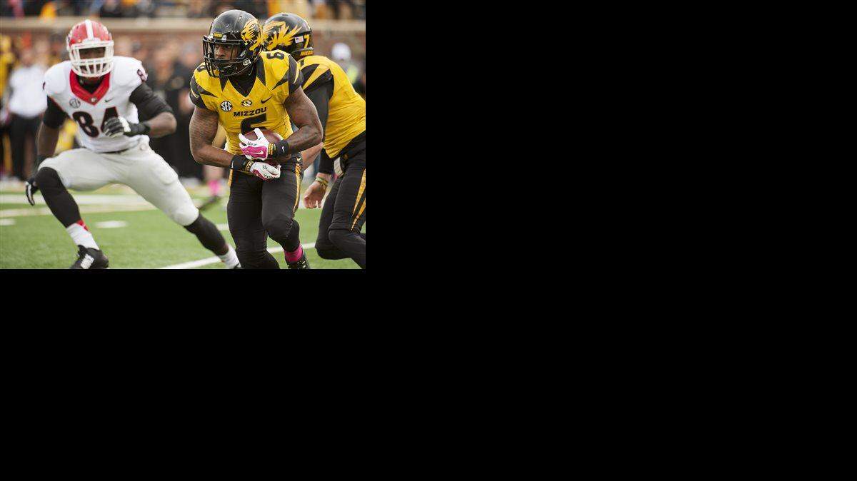 
Missouri's Marcus Murphy, right, returns a kickoff as Georgia's Leonard Floyd, left, moves in during the first quarter of Saturday’s game in Columbia.
