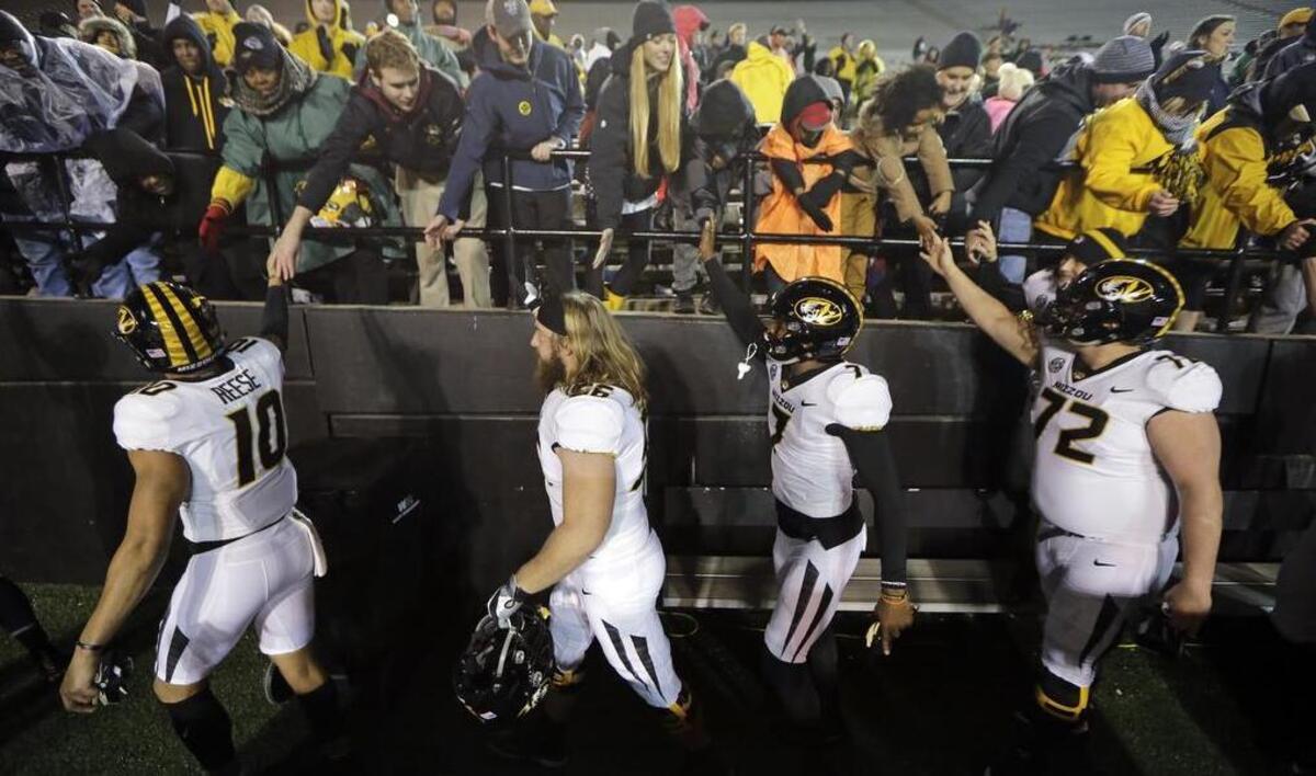 Missouri players celebrate with fans after defeating Vanderbilt 45-17 in an NCAA college football game Saturday, Nov. 18, 2017, in Nashville, Tenn.