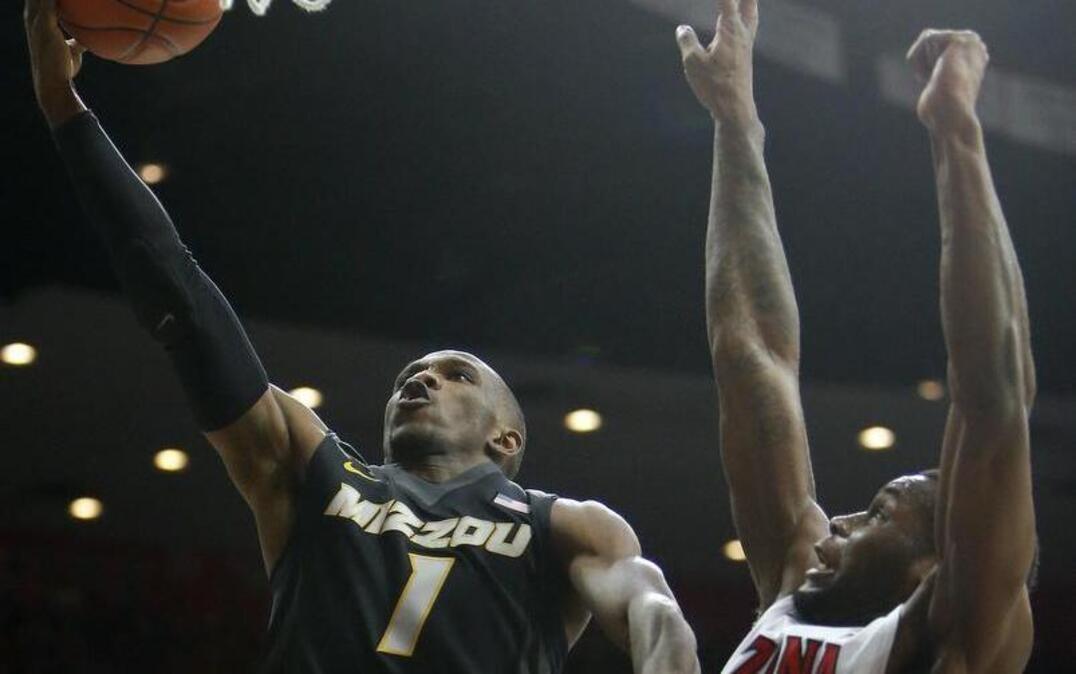 Missouri guard Terrence Phillips (left) took the ball to the basket against Arizona last Sunday.