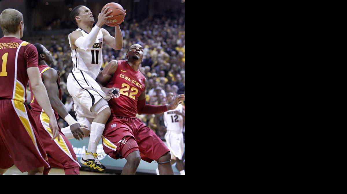 
MU's Michael Dixon, a junior, helped save senior night in 2012 at Mizzou Arena. Dixon helped lead the Tiger comeback by scoring a game-high 21 points on eight-of-10 shooting. He also finished with five rebounds, four assists and a block in the 78-72 win over Iowa State. He blew through a trio of ISU defenders, including Anthony Booker (right) for a layup in the second half. 
