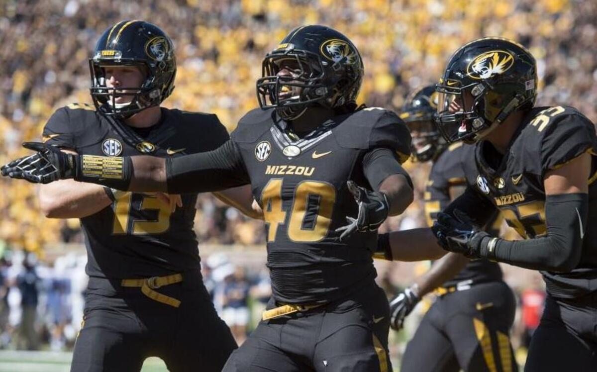 
Missouri linebacker Clarence Green (40) celebrated after scoring a safety on a blocked punt in the first quarter of Saturday game against Connecticut at Faurot Field.
