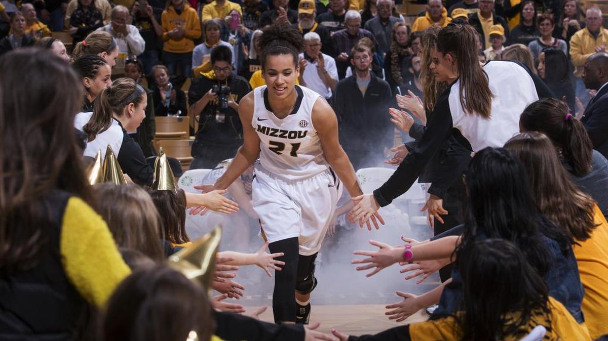 Missouri's Cierra Porter is greeted by teammates and fans as she is introduced before the start of an NCAA college basketball game against Mississippi State, Thursday, Jan. 14, 2016, in Columbia, Mo. Missouri won 66-54.(AP Photo/L.G. Patterson)