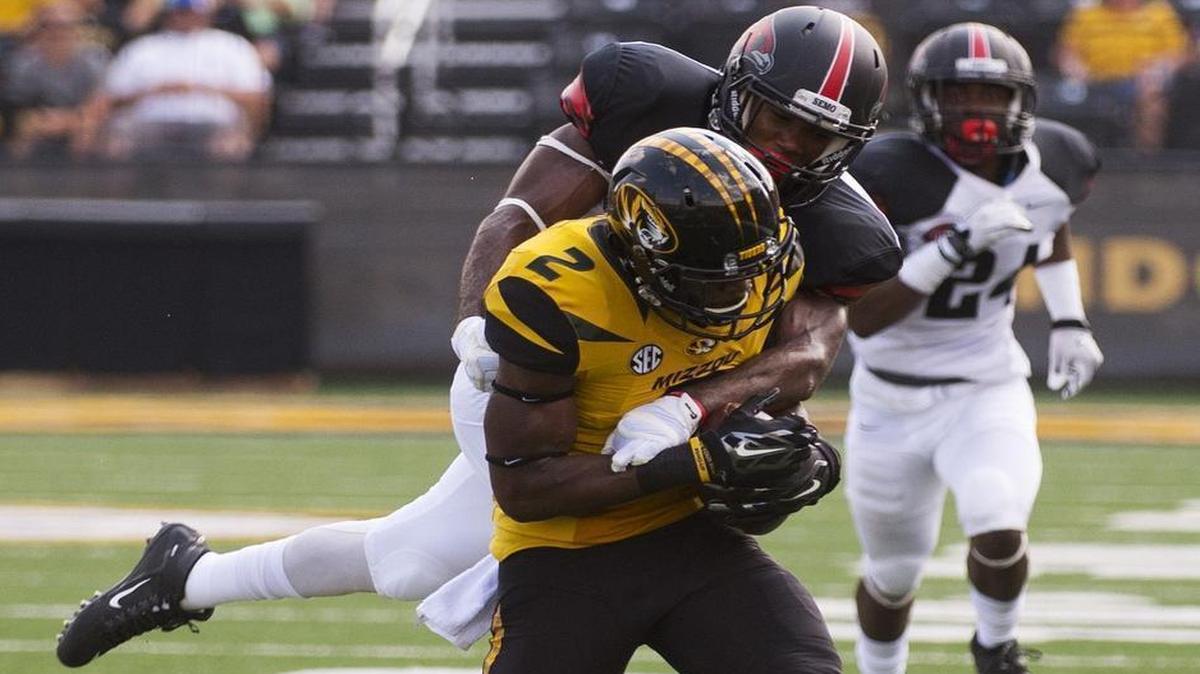 
Missouri receiver Nate Brown caught a pass in front of Southeast Missouri State’s David Coley during the first half of Saturday’s game in Columbia, Mo. 
