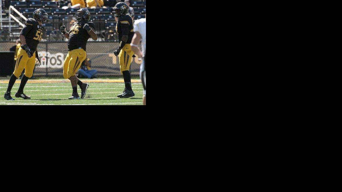 
Missouri's Lucas Vincent, center, celebrated a sack with teammates Shane Ray, left, and Harold Brantley in the fourth quarter of Saturday’s game. 
