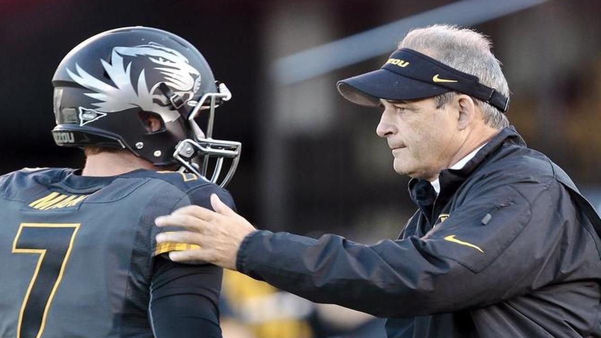 
Missouri coach Gary Pinkel greeted quarterback Maty Mauk (7) before the start of the Oct. 26, 2013, football game against South Carolina Gamecocks at Faurot Field.
