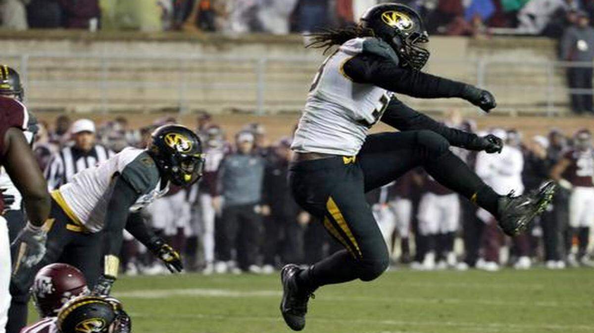 
Missouri defensive lineman Markus Golden celebrated stopping Texas A&M on fourth down near the goal line in the fourth quarter last Saturday in College Station, Texas. Missouri won the game 34-27 and hopes to maintain its lead in the Southeastern Conference’s East division with a win over Tennessee tonight in Knoxville. 

