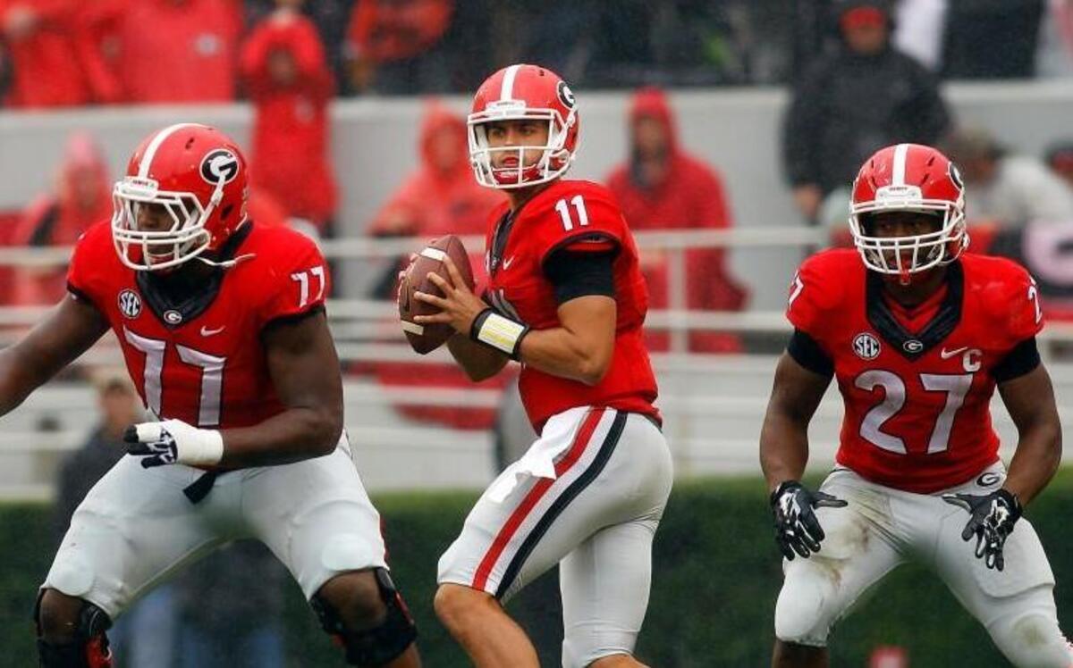 
Georgia quarterback Greyson Lambert (11) drops back to pass behind blockers Georgia guard Isaiah Wynn (77) and Nick Chubb (27) during their Oct. 3 SEC game against Alabama in Athens, Ga.
