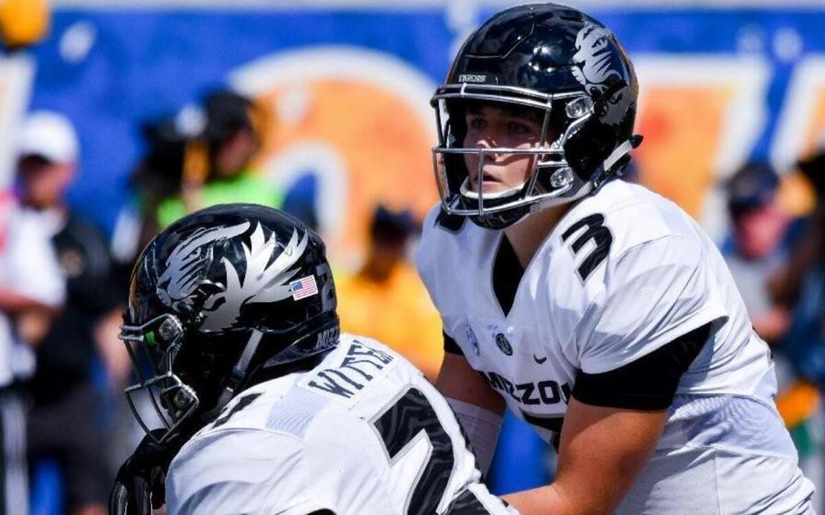 Missouri quarterback Drew Lock handed the ball off to Ish Witter in the second half of Saturday’s loss to West Virginia in Morgantown, W. Va.