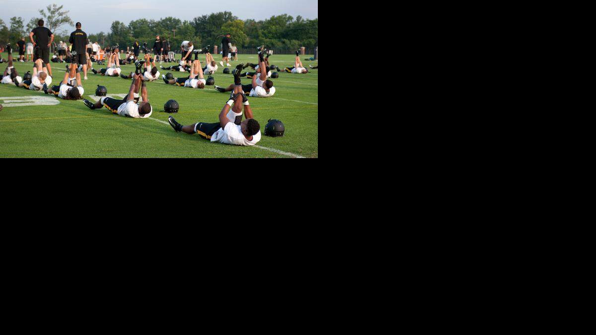 
The Missouri Tigers went through stretching exercises Tuesday as they started football preseason practice this week in Columbia.
