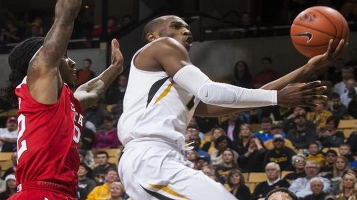 Missouri’s Terrence Phillips (center) shot between North Carolina State’s Caleb Marti (right) and Anthony Barber in the first half Saturday at Mizzou Arena in Columbia.