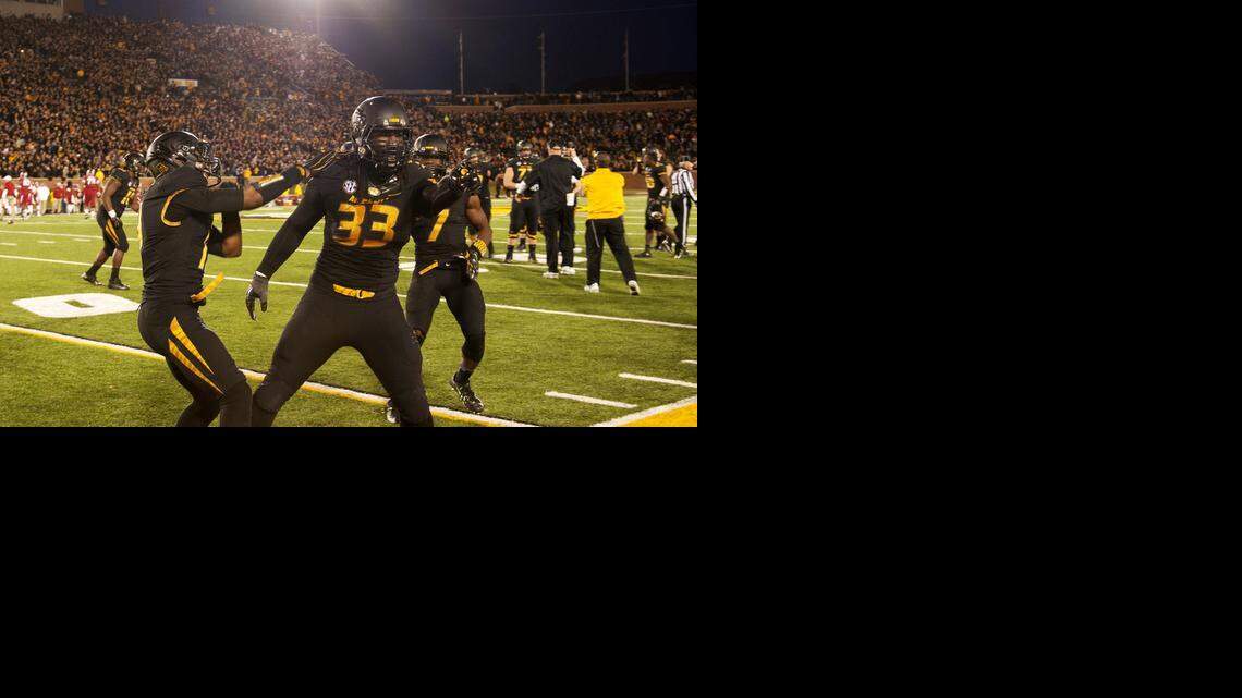 
Missouri defensive lineman Markus Golden (center) forced a fumble and recovered another on Friday against Arkansas.


