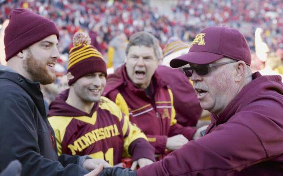 
In this Nov. 22, 2014, file photo, Minnesota head coach Jerry Kill celebrates with fans after a 28-24 win over Nebraska in Lincoln, Neb.
