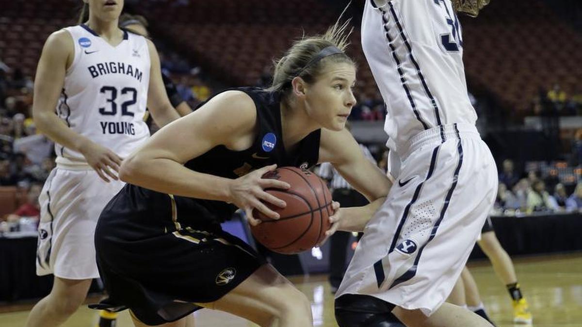 Missouri forward Jordan Frericks, center, is pressured by Brigham Young forward Micaelee Orton (34) as she looks to shoot during a first-round women's college basketball game in the NCAA Tournament, Saturday, March 19, 2016, in Austin, Texas. (AP Photo/Eric Gay)
