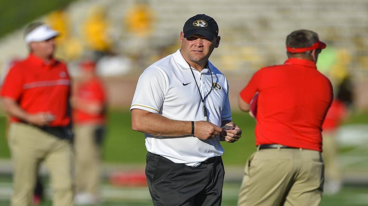 Barry Odom (center) is preparing for his second season as head football coach of the Missouri Tigers.