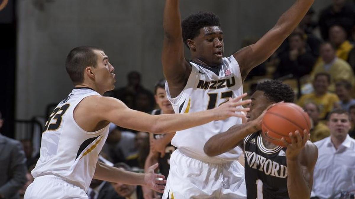 Wofford's Derrick Brooks (right) is surrounded by Missouri's Namon Wright (center) and Cullen VanLeer during Friday’s college basketball game in Columbia.