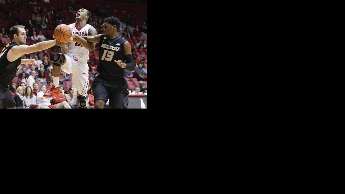 
Alabama guard Levi Randolph (20) is fouled by Missouri guard Montaque Gill-Caesar (13) during the second half of an NCAA college basketball game Wednesday, Feb. 4, 2015, in Tuscaloosa, Ala. (AP Photo/Brynn Anderson)
