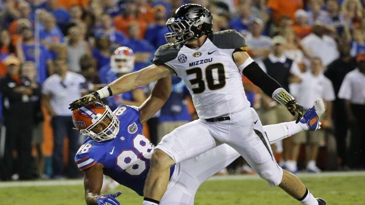 Missouri linebacker Michael Scherer (right) broke up a pass intended for Florida tight end Clay Burton in their game last month in Columbia.
