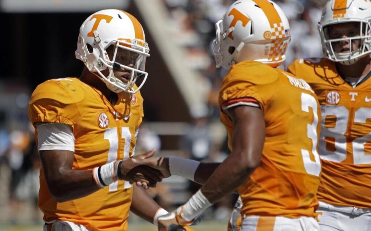 Tennessee quarterback Joshua Dobbs (left) congratulated wide receiver Josh Malone after scoring a touchdown during a game earlier this year.