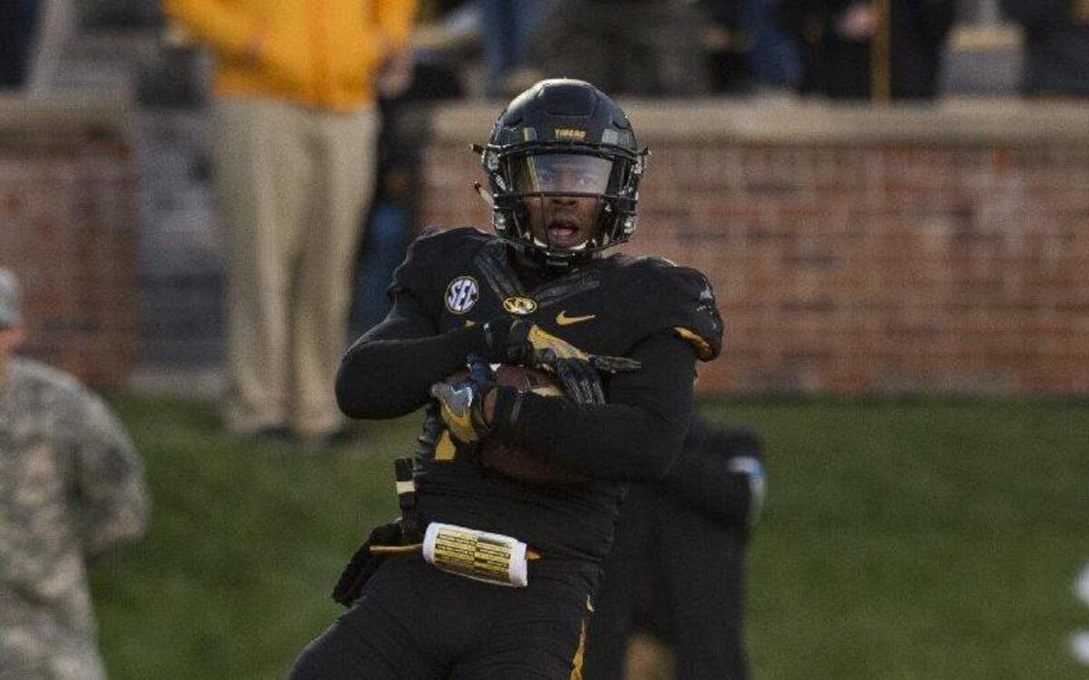Missouri’s Aarion Penton intercepted a pass in the end zone in the fourth quarter of the Tigers’ 28-24 win over Arkansas on Friday in Columbia.