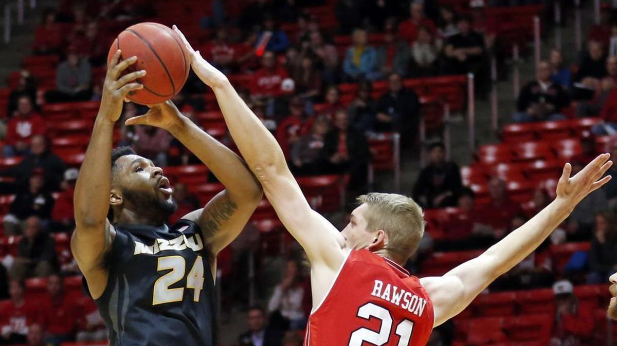 Kevin Puryear tried to get a shot off against Utah’s Tyler Rawson in a game played Nov. 16, 2017. Utah beat the Missouri Tigers 77-59. They’ll meet again this season in Columbia