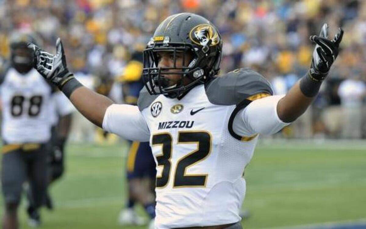 
Missouri running back Russell Hansbrough celebrated after a 16-yard touchdown run against Toledo in the first quarter of Saturday’s game.
