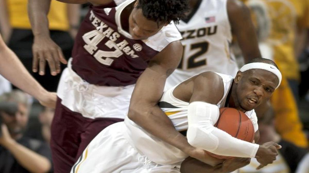 Missouri’s Terrence Phillips (front) stole the ball from Texas A&M’s Tavario Miller in the first half as the Tigers and Aggies played Saturday at Mizzou Arena in Columbia.