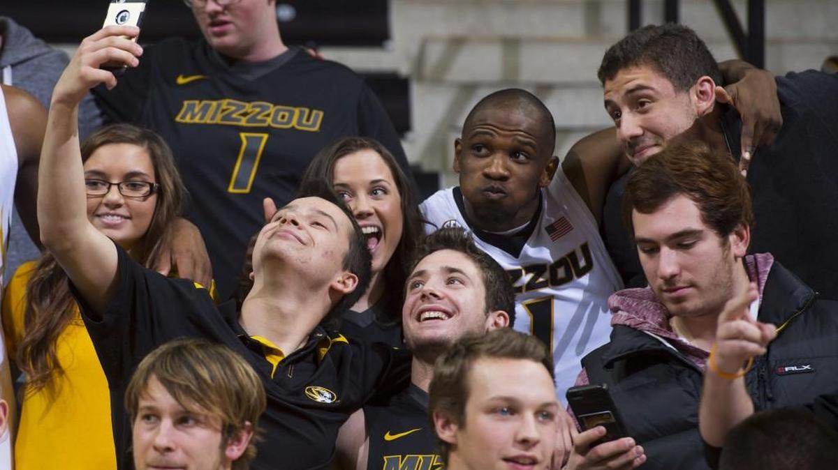 Missouri's Terrence Phillips posed for a selfie with fans after the Tigers defeated Nebraska-Omaha 85-78 Wednesday in Columbia.
