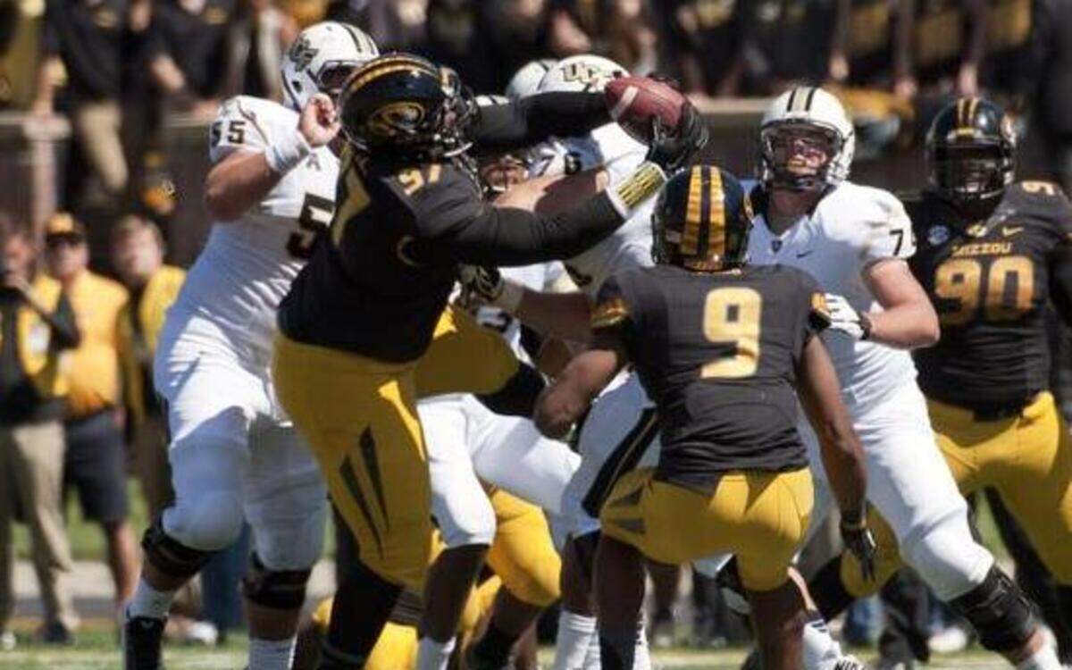 
Missouri defensive tackle Josh Augusta showed off his good hands when he pulled down an interception in a crowd of players in the third quarter of Saturday’s game against Central Florida.


 
