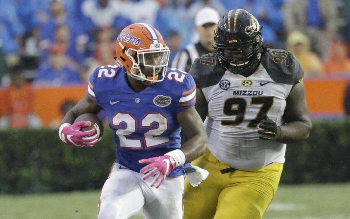 MU senior defensive tackle Josh Augusta chased after Florida running back Lamical Perine on this play in the second half of Saturday’s game in Gainesville, Fla. Augusta also ran for his first career touchdown in the second half.