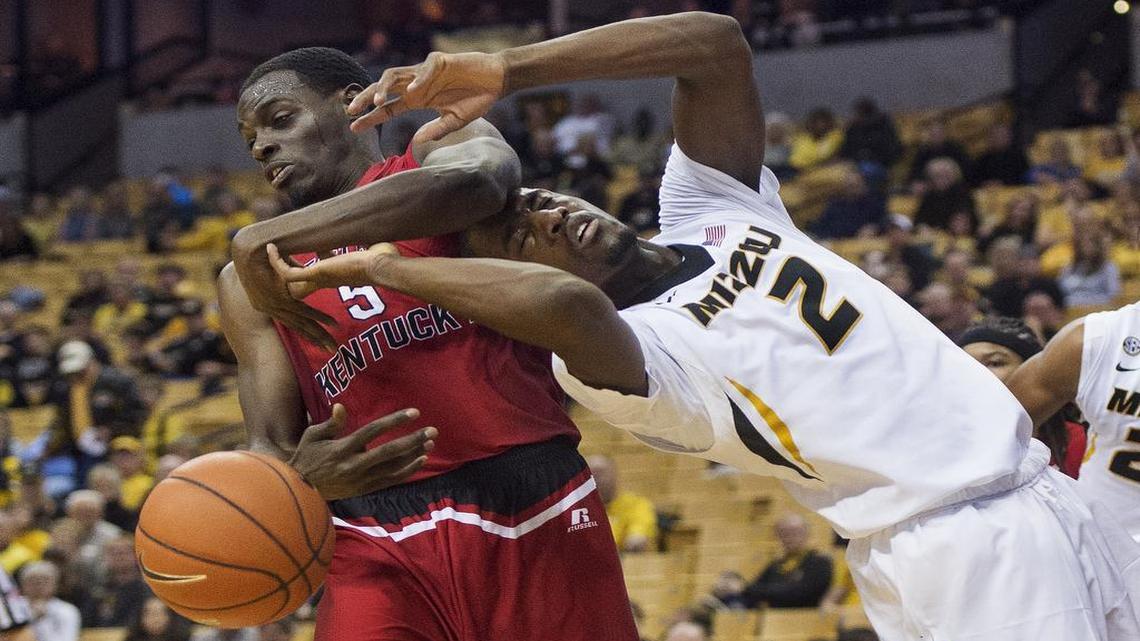 Western Kentucky's Junior Lomomba, left, battles Missouri's Willie Jackson for a rebound during the first half of an NCAA college basketball game Saturday, Dec. 3, 2016, in Columbia, Mo.