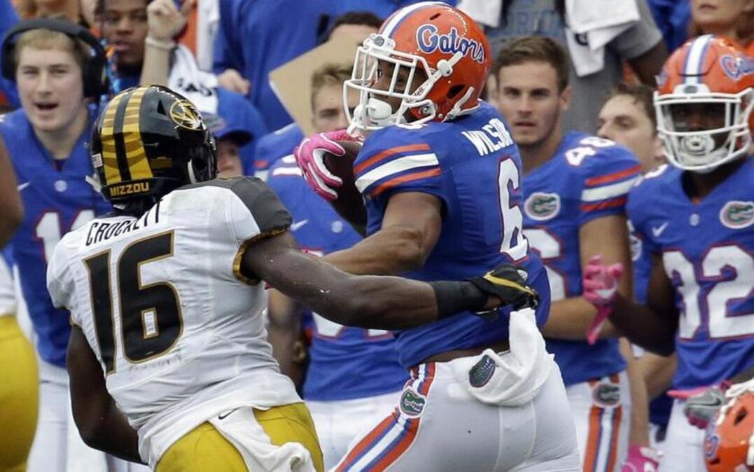 Florida’s Quincy Wilson got by Mizzou running back Damarea Crockett on his way to a 78-yard touchdown after intercepting a pass during the first half of Saturday’s game in Gainesville, Fla. Crockett, a freshman, showed his immense potential with 14 carries for 145 yards, which are both career highs.