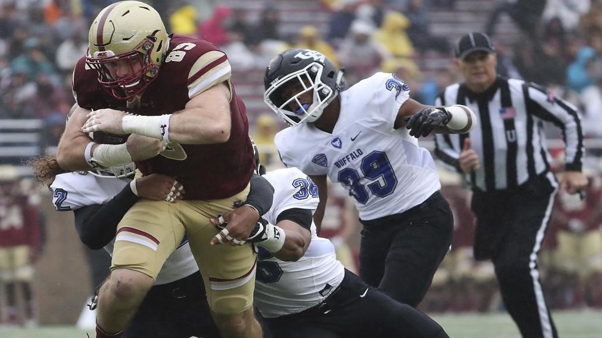 Boston College tight end Tommy Sweeney dragged Buffalo defense players after a reception during a game earlier this month.