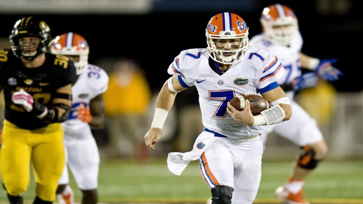 
Florida quarterback Will Grier (right) ran with the ball in the second half of Saturday’s game at Missouri.
