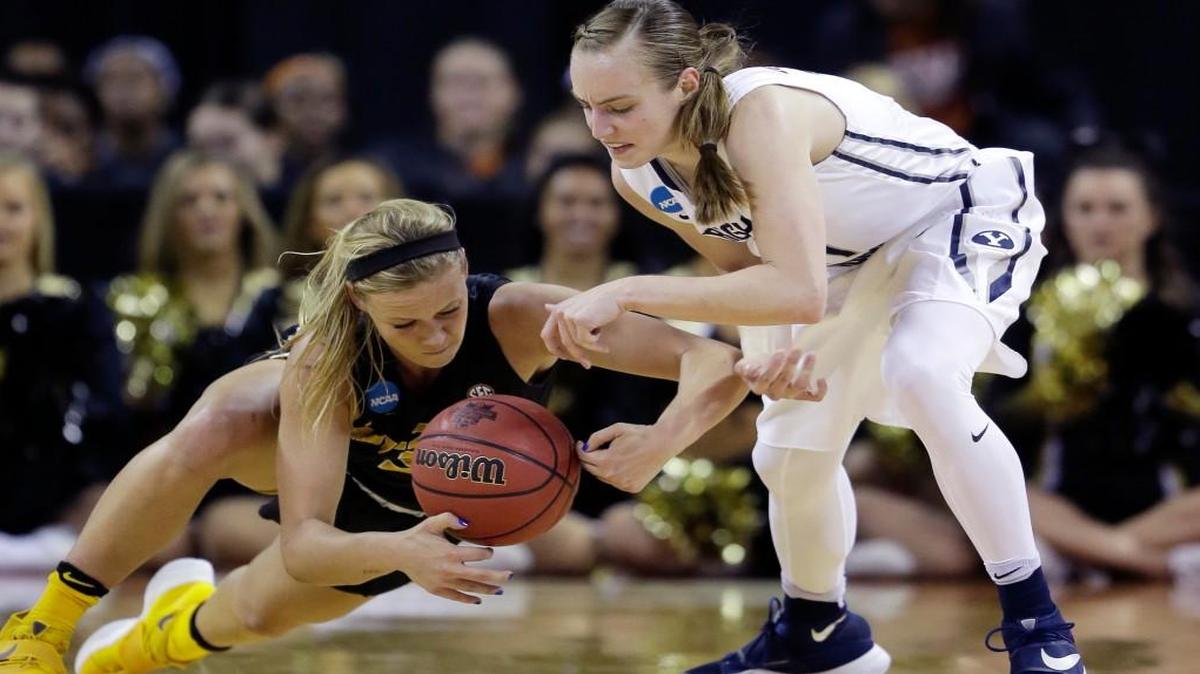 Missouri guard Sophie Cunningham (left) and BYU’s Lexi Eaton Rydalch scrambled for a loose ball Saturday in their first-round match in the NCAA Tournament.