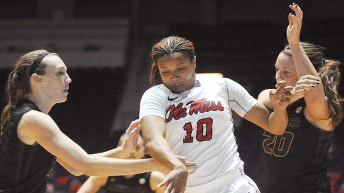 
In this file photo, Mississippi’s Diara Moore (10) drove between Missouri’s Morgan Stock (left) and Kayla McDowell (20) in a game Jan. 2 in Oxford, Miss. McDowell’s 2014-15 season is finished after she suffered a torn ACL in her left knee Friday against Colorado.
