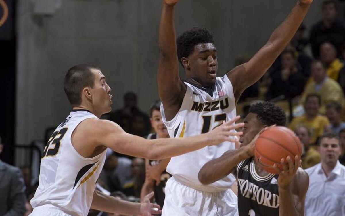 Wofford's Derrick Brooks, right, is surrounded by Missouri's Namon Wright, center, and Cullen VanLeer, left, during the first half of a game last season.