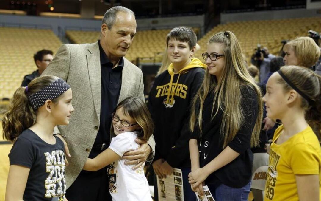 Gary Pinkel was surrounded by family after a news conference on Nov. 16 to announce his retirement as Missouri’s football coach.