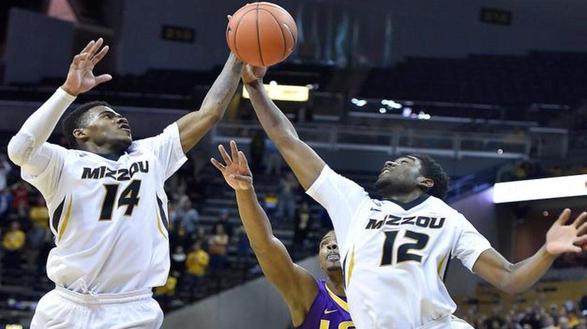 
After a late LSU miss, MU's Keith Shamburger (14) and Namon Wright gathered in the final rebound and MU went on to beat LSU, 74-67 in overtime Thursday night at Mizzou Arena.
